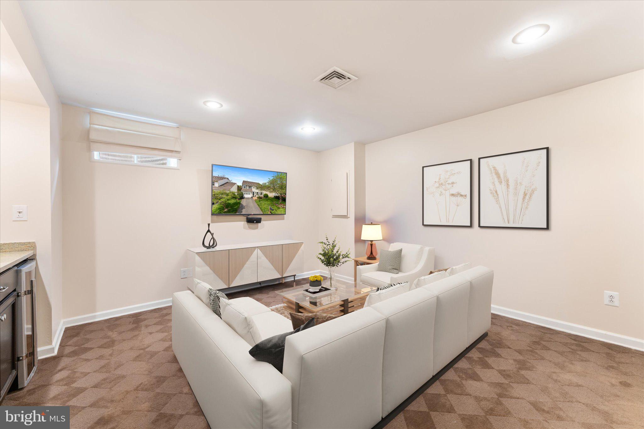 21047 Barcroft Way Sterling, VA 20164 - Photo 35 of 47 a living room with furniture and a flat screen tv