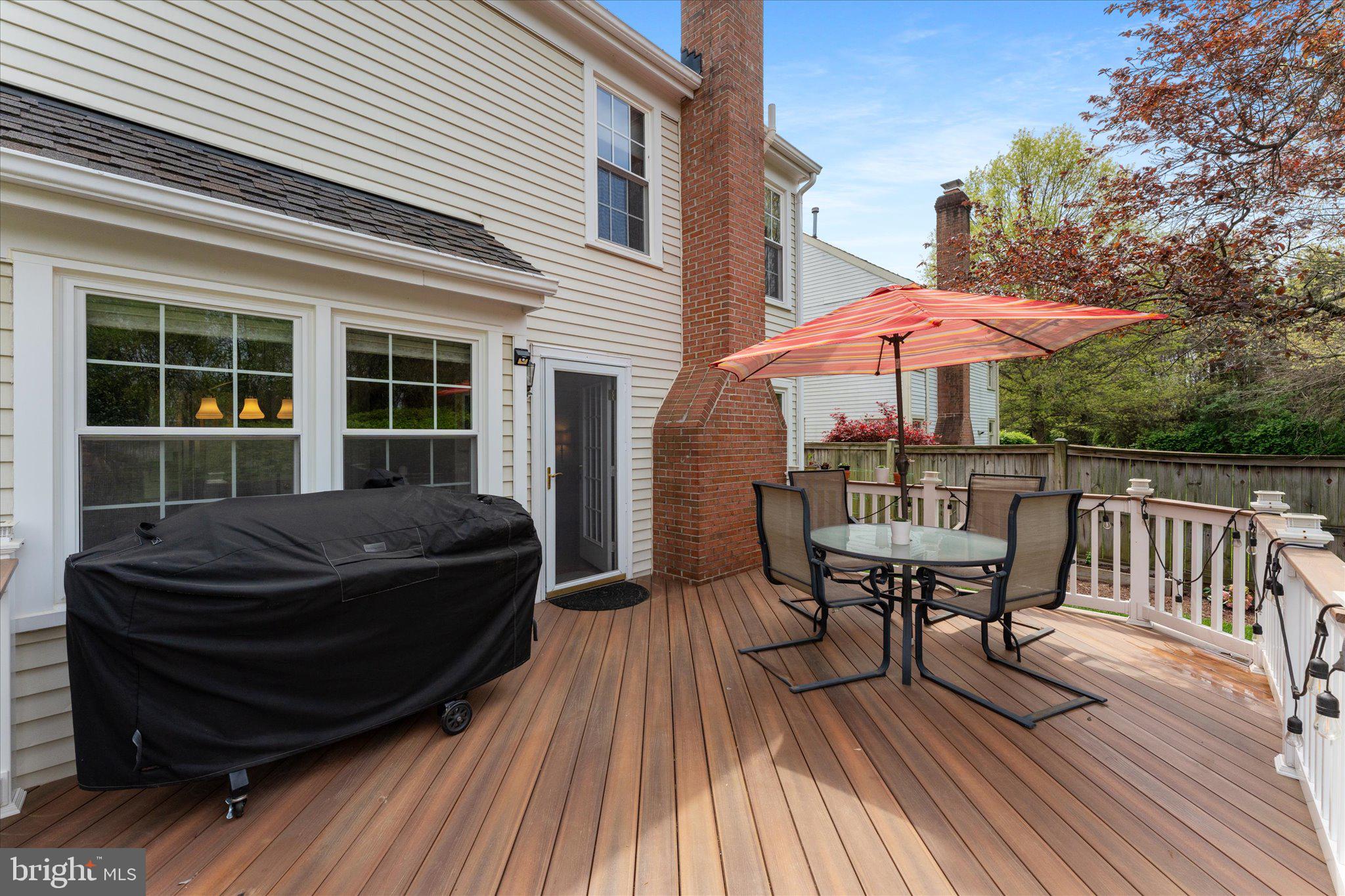21047 Barcroft Way Sterling, VA 20164 - Photo 39 of 47 a view of house with deck outdoor seating and wooden floor
