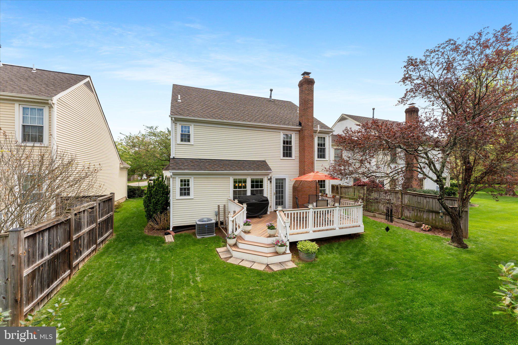 21047 Barcroft Way Sterling, VA 20164 - Photo 40 of 47 a view of a house with a yard deck and a large tree
