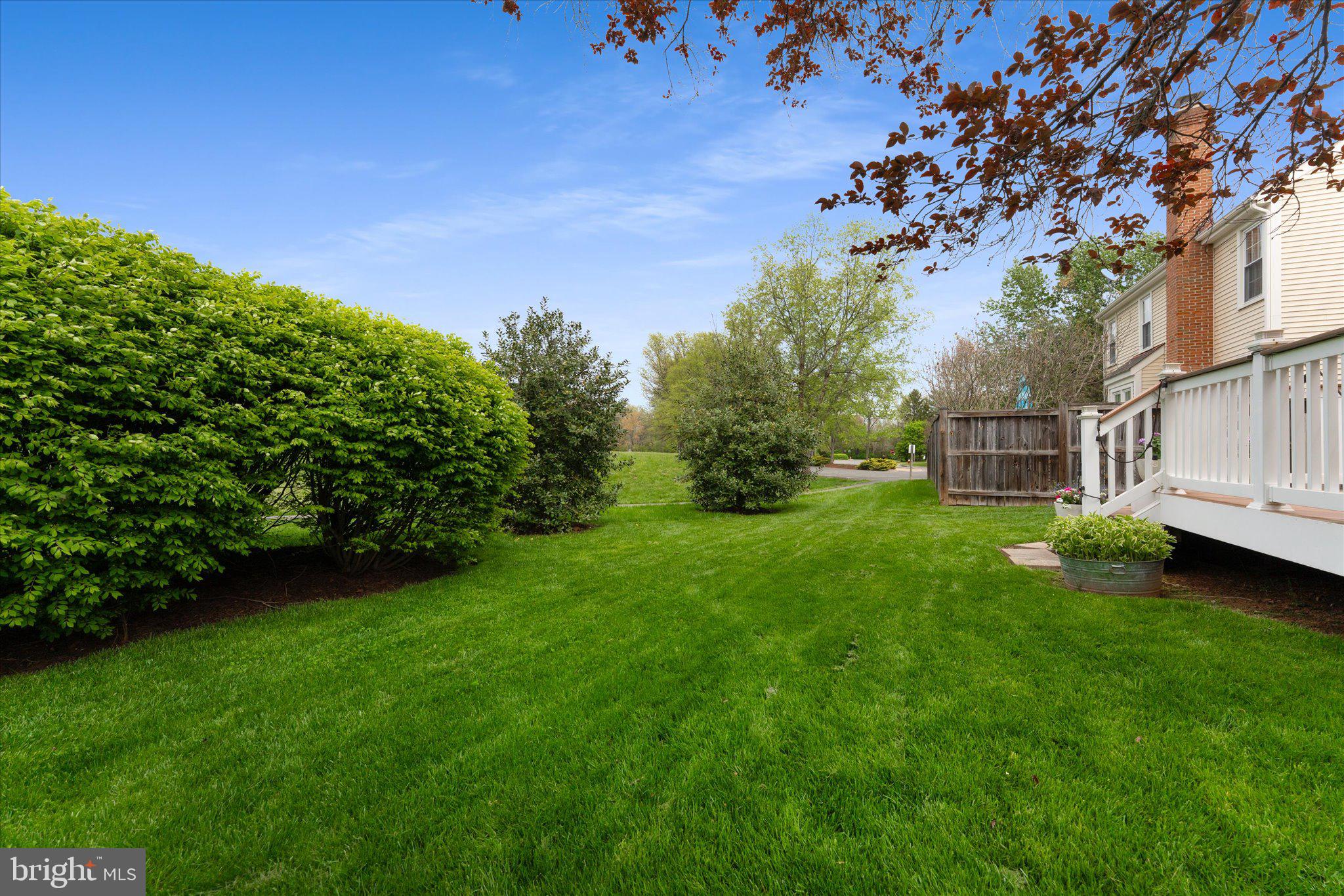 21047 Barcroft Way Sterling, VA 20164 - Photo 43 of 47 a backyard of a house with lots of green space