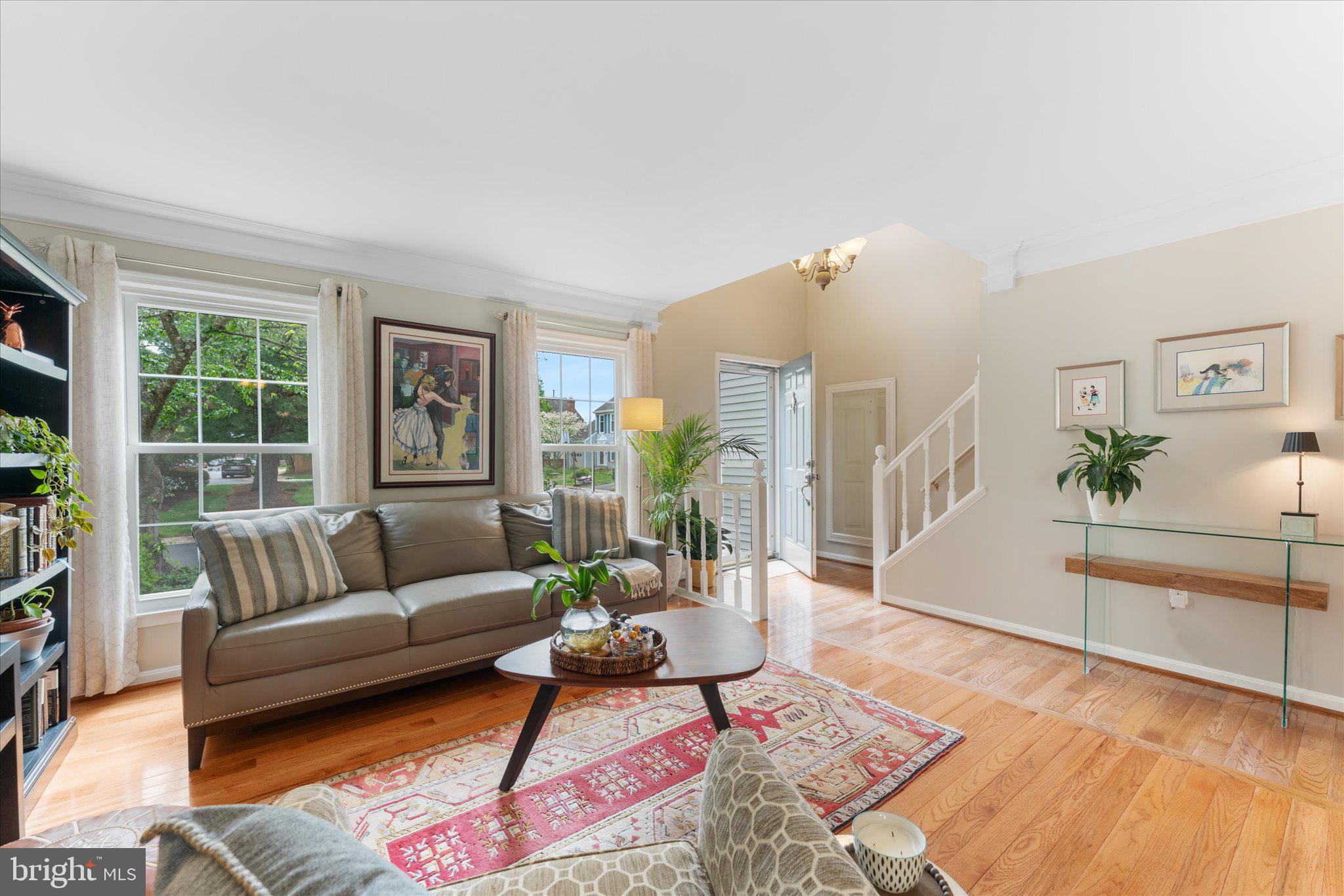 21047 Barcroft Way Sterling, VA 20164 - Photo 6 of 47 a living room with furniture and a wooden floor