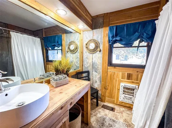 a bathroom with a sink and a mirror