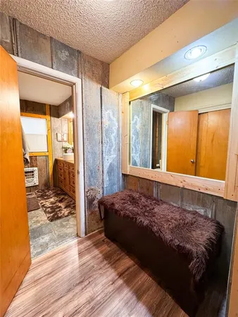 a bathroom with a granite countertop sink and a shower