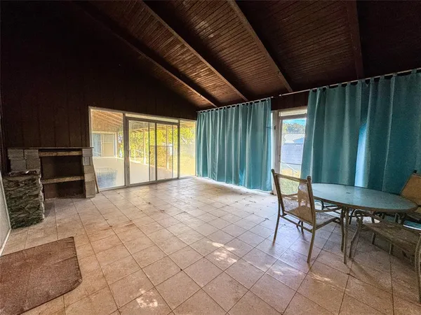 a large kitchen with stainless steel appliances granite countertop a stove a sink and a refrigerator