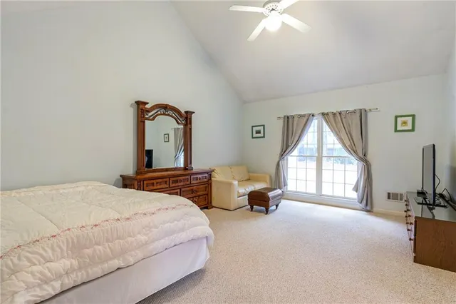 a bedroom with furniture and a window