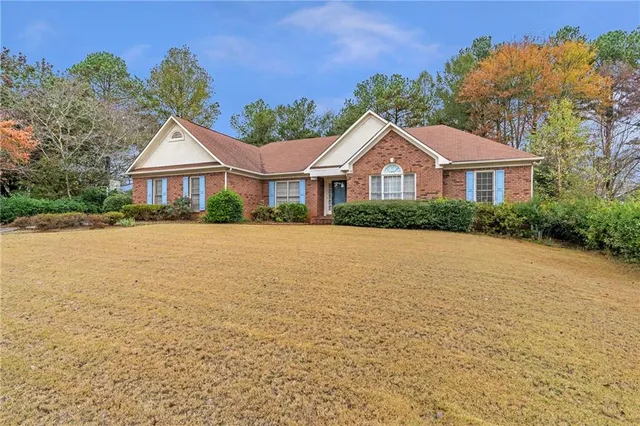 front view of a house with a yard