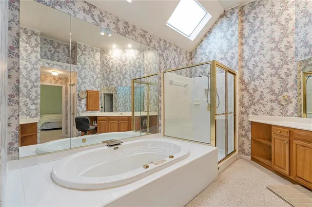 a view of a bathroom with a sink and a mirror