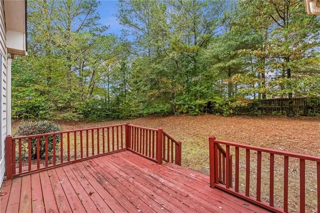 a view of deck with two chairs and wooden floor