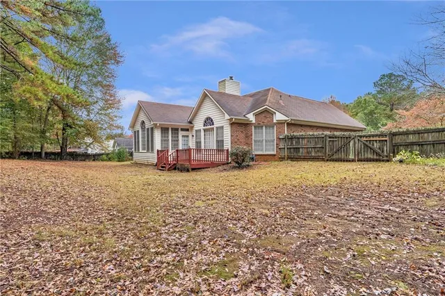 a house view with a backyard space