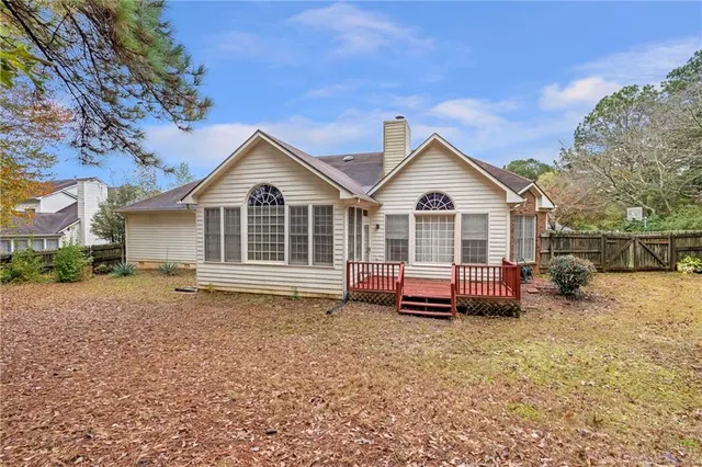 a house with a tree in front of it