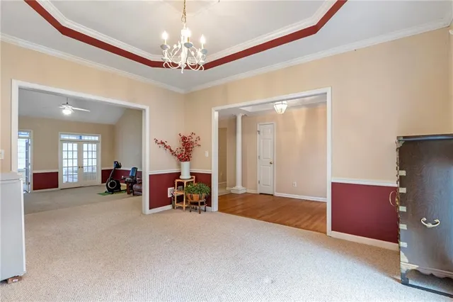 a room with gym equipment and a fireplace