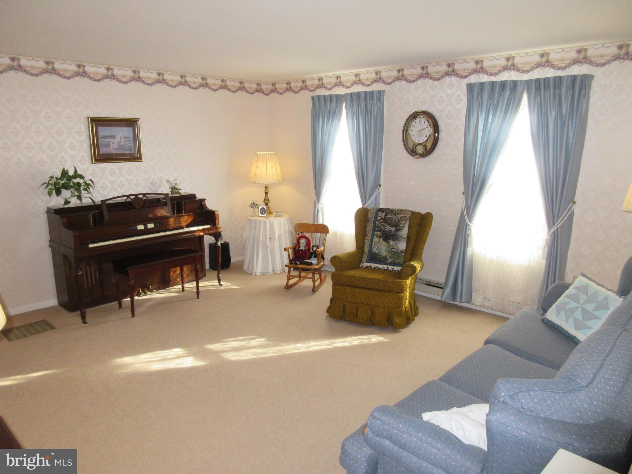 160 April Lane Lititz, PA 17543 - Photo 2 of 27 a living room with furniture and a clock