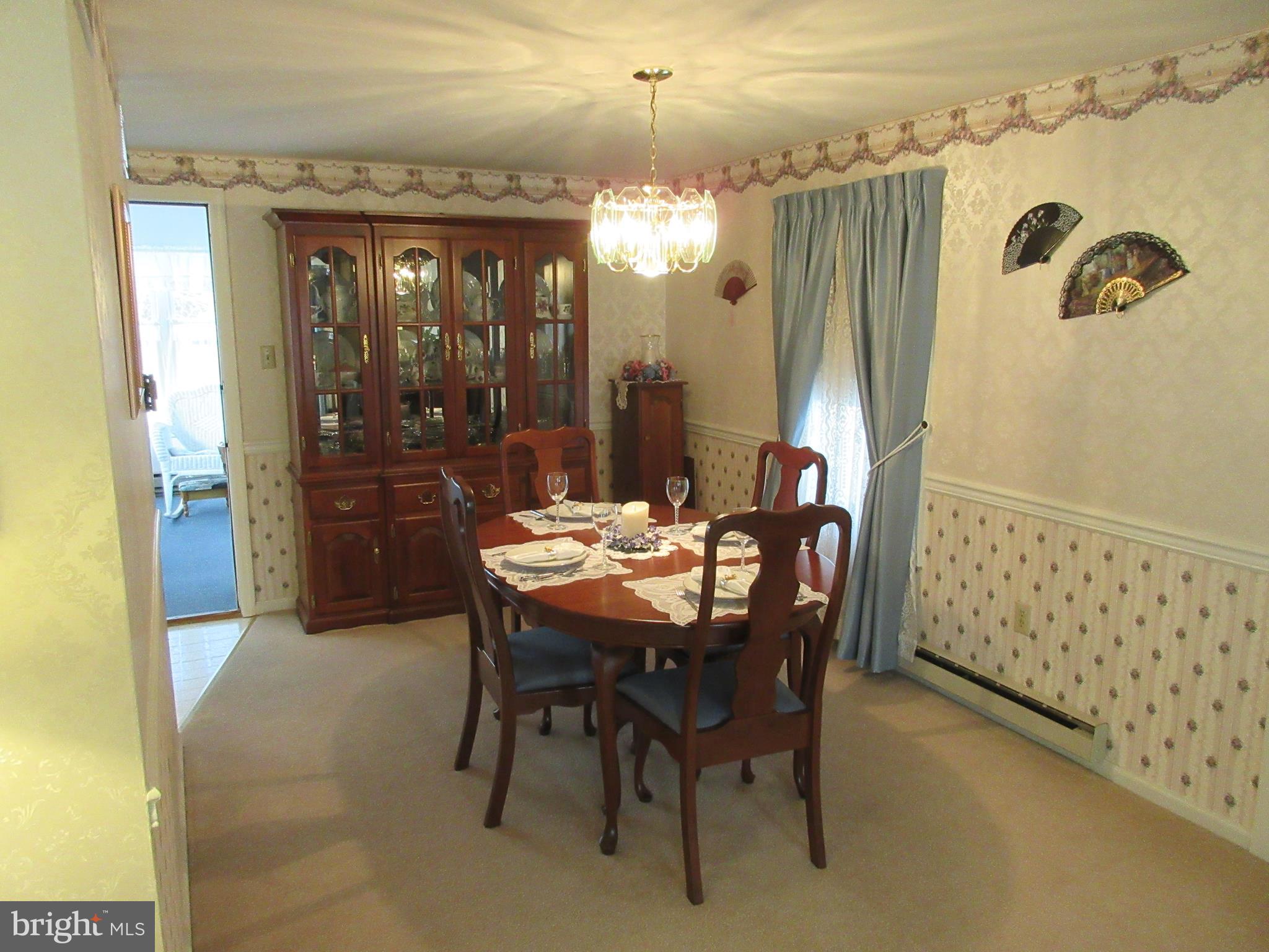 160 April Lane Lititz, PA 17543 - Photo 4 of 27 a view of a dining room with furniture and chandelier