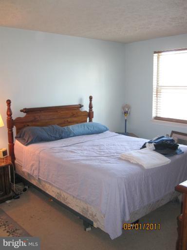3908 Misty View Road Middle River, MD 21220 - Photo 3 of 20 a bedroom with a bed and window