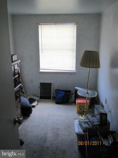 3908 Misty View Road Middle River, MD 21220 - Photo 9 of 20 a room with furniture a rug and a window