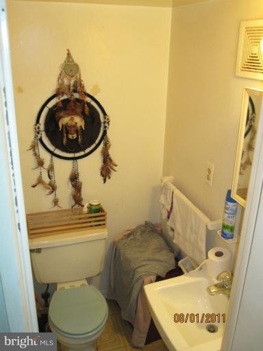 3908 Misty View Road Middle River, MD 21220 - Photo 10 of 20 a bathroom with a toilet and a sink