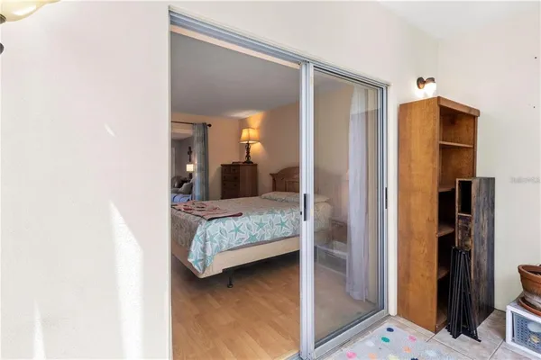 a bedroom with a bed and a mirror