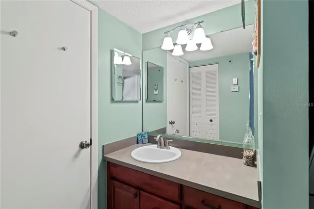 a bathroom with a sink and a mirror