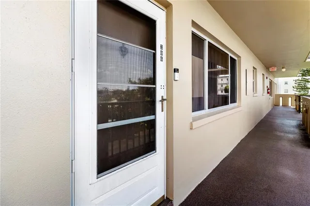 a view of a hallway with entryway and front door