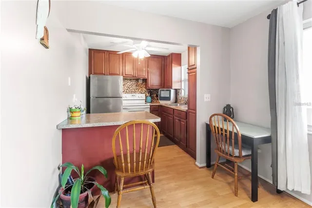 a dining room with furniture and a window