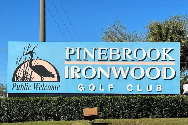 a view of a swimming pool with an outdoor seating