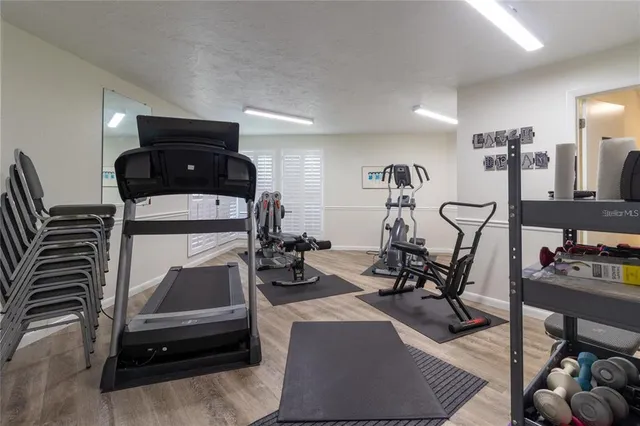 a large white kitchen with stainless steel appliances