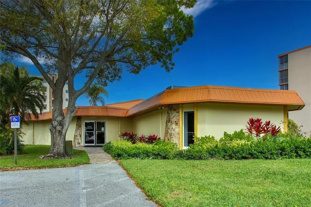 an aerial view of a house with outdoor space and pool