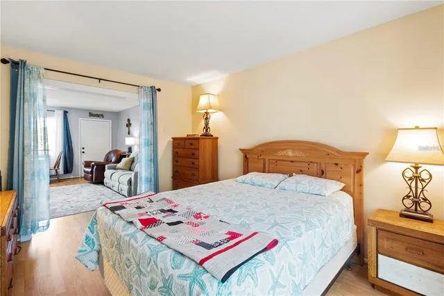 a bedroom with a bed and a view of bathroom