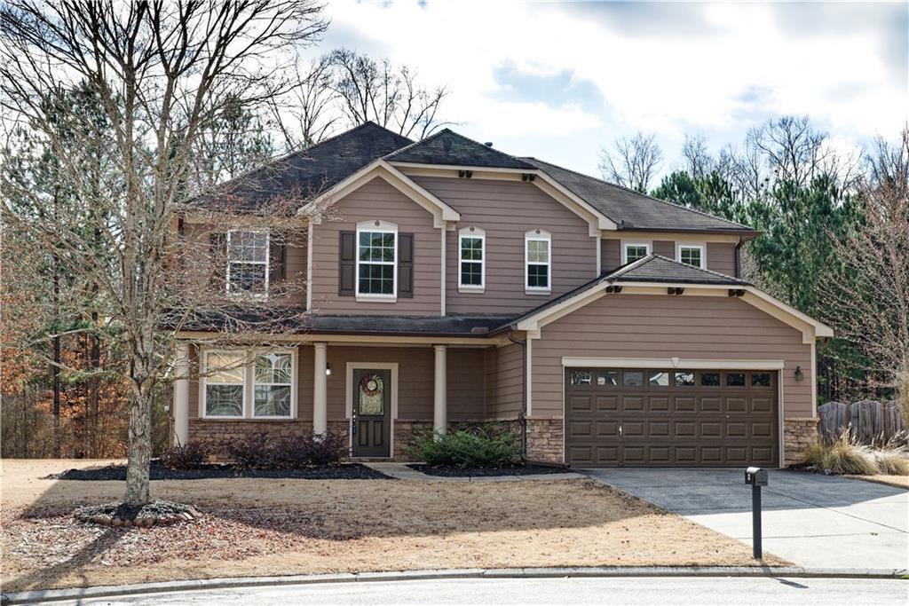 a front view of a house with yard