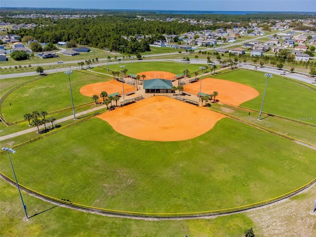 2159 Rio Grande Canyon Loop Poinciana, FL 34759 - Photo 21 of 25 a view of a swimming pool with a table and chairs