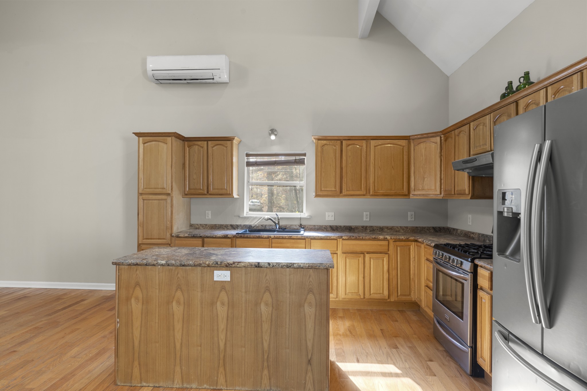 1148 Stoltz Road Centerville, TN 37033 - Photo 13 of 63 a kitchen with stainless steel appliances granite countertop a refrigerator a stove top oven a sink and dishwasher