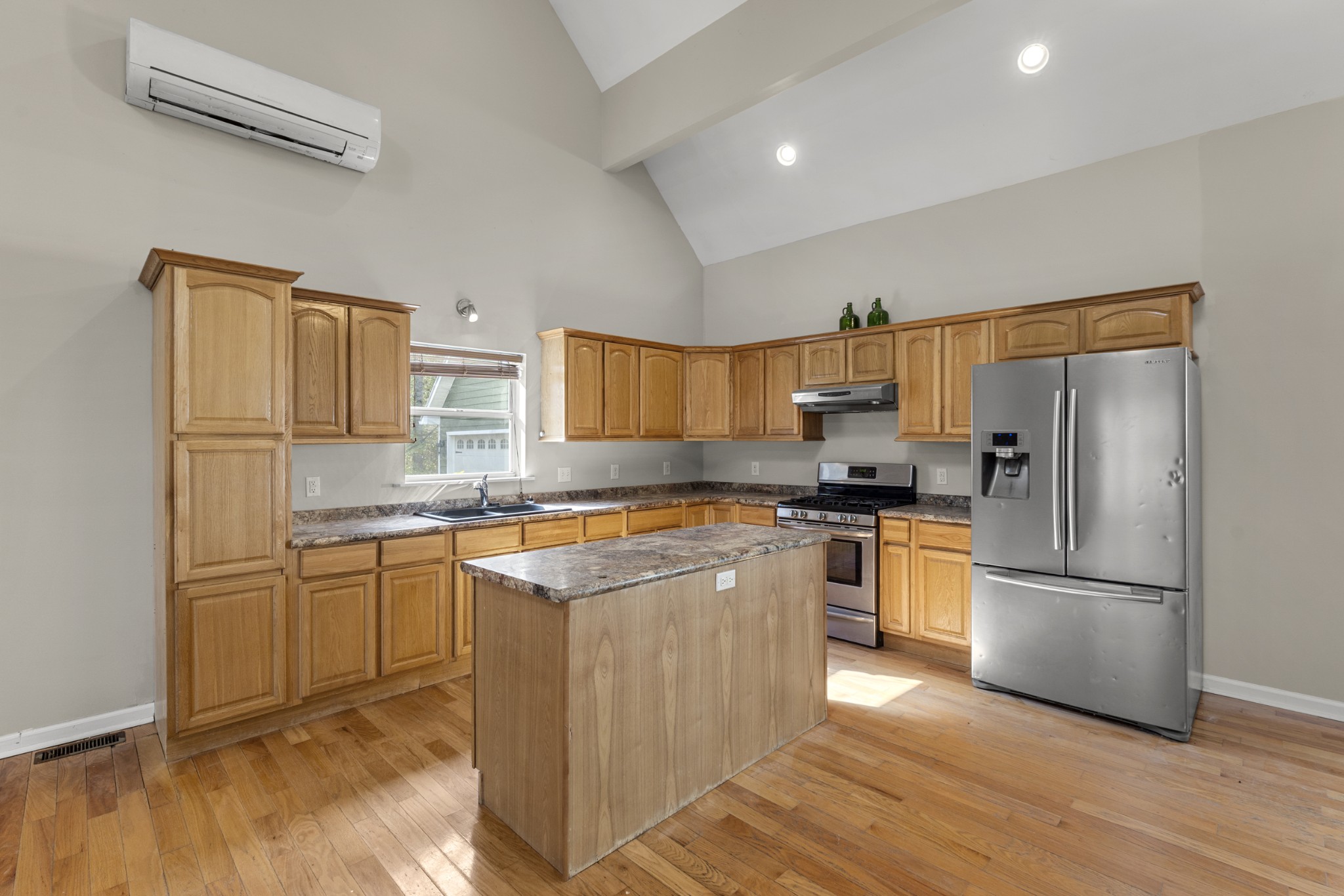 1148 Stoltz Road Centerville, TN 37033 - Photo 15 of 63 a kitchen with stainless steel appliances granite countertop a refrigerator a stove a sink and a microwave