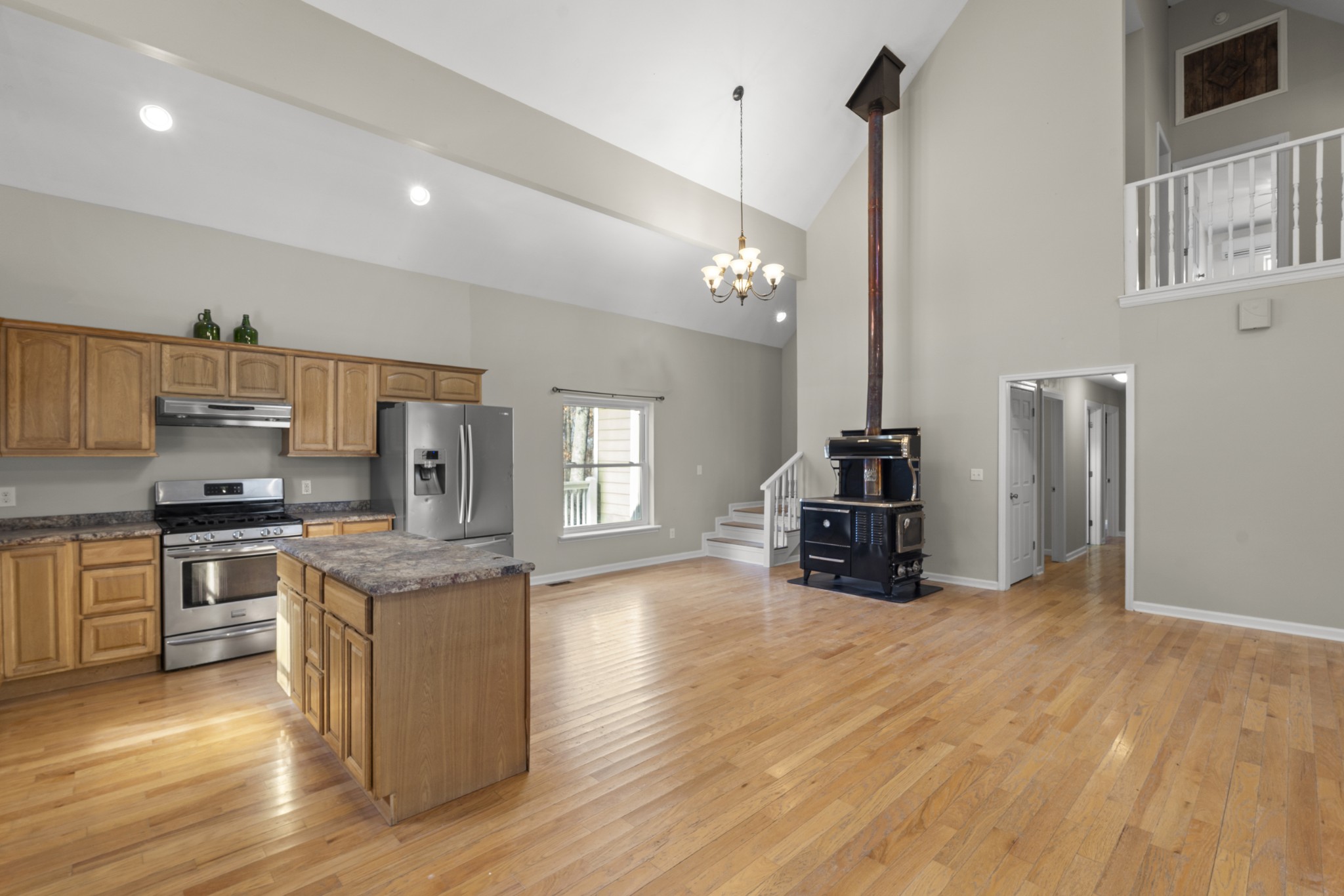 1148 Stoltz Road Centerville, TN 37033 - Photo 16 of 63 a kitchen with stainless steel appliances granite countertop a stove and a refrigerator