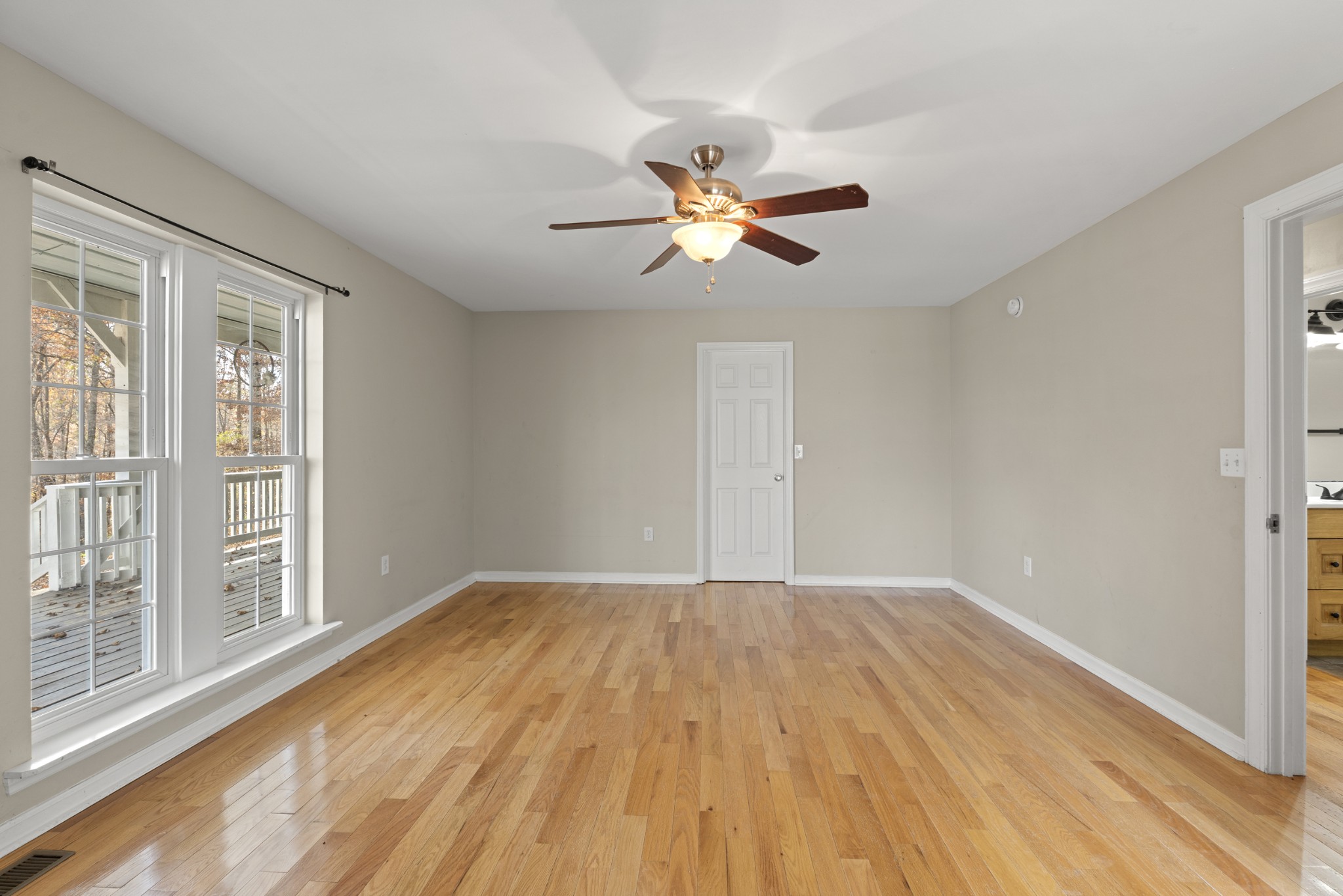 1148 Stoltz Road Centerville, TN 37033 - Photo 24 of 63 a view of empty room with wooden floor and fan