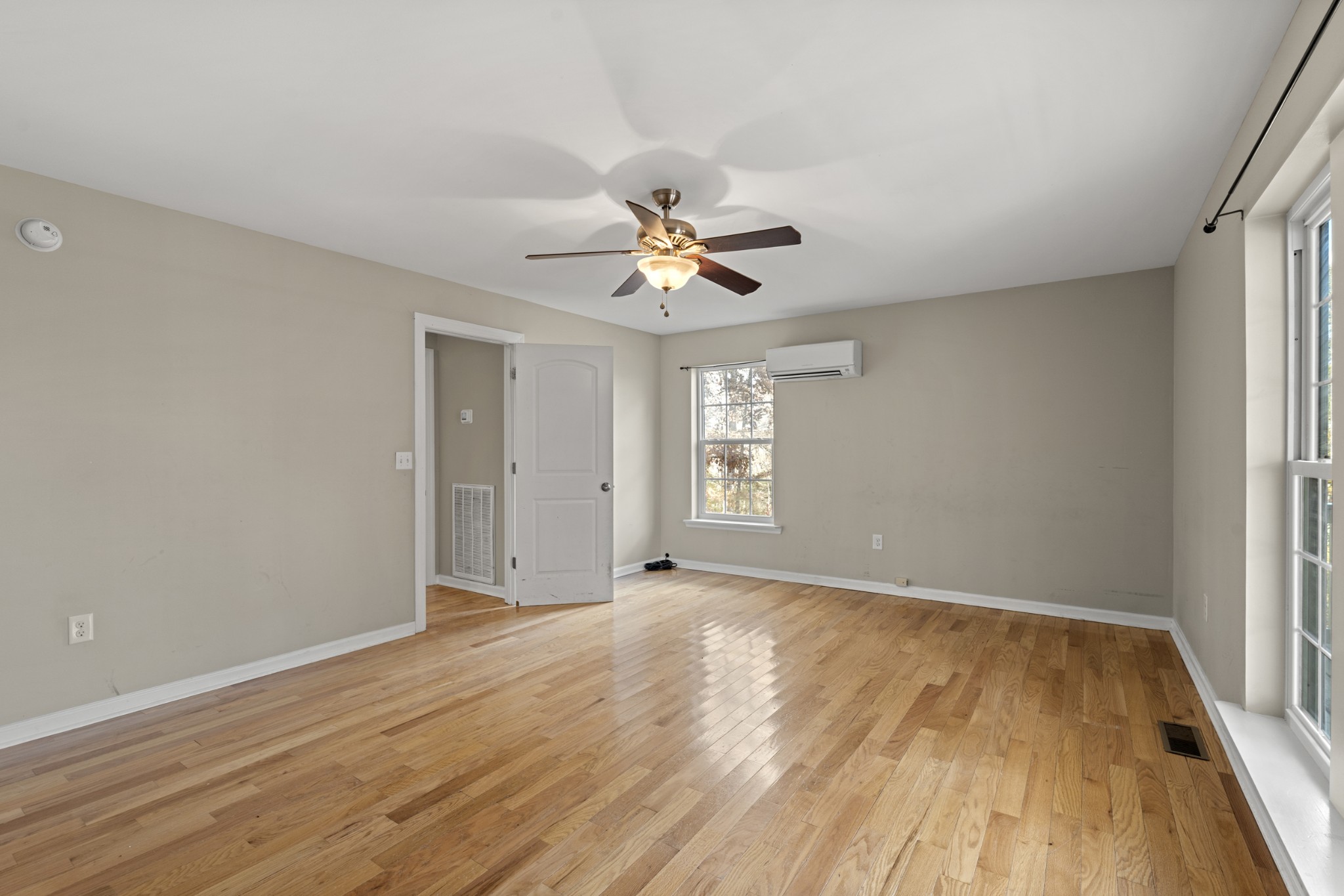 1148 Stoltz Road Centerville, TN 37033 - Photo 25 of 63 wooden floor in an empty room with a window