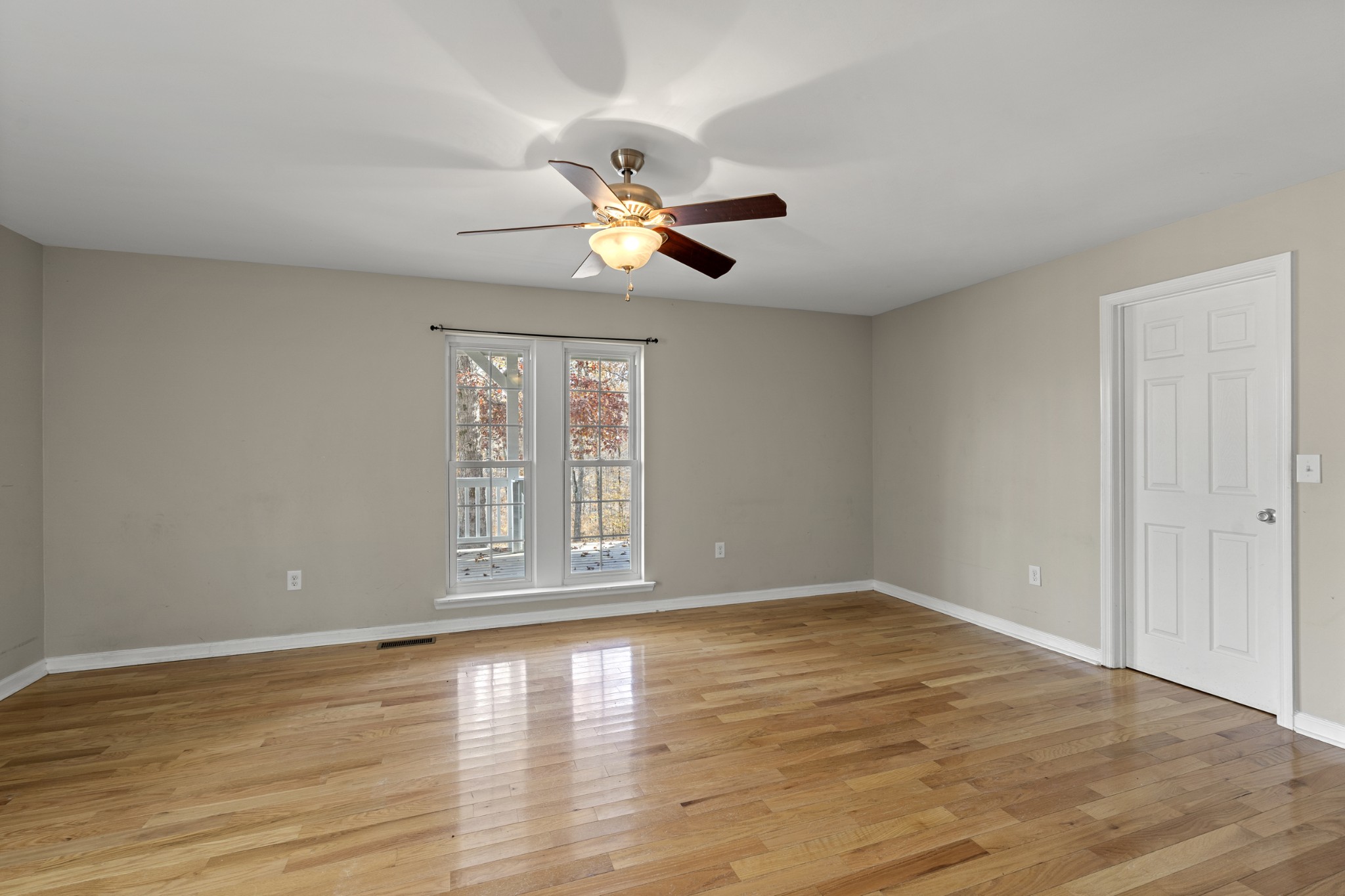 1148 Stoltz Road Centerville, TN 37033 - Photo 26 of 63 a view of an empty room with wooden floor and a window