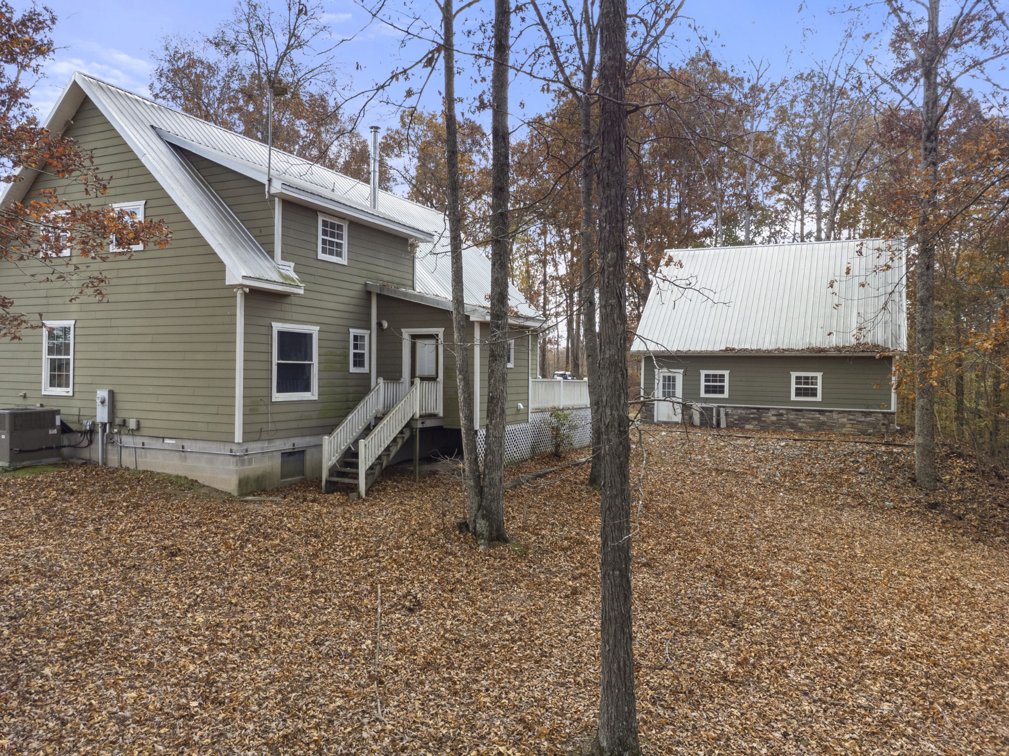 1148 Stoltz Road Centerville, TN 37033 - Photo 36 of 63 a view of a house with a yard and large tree