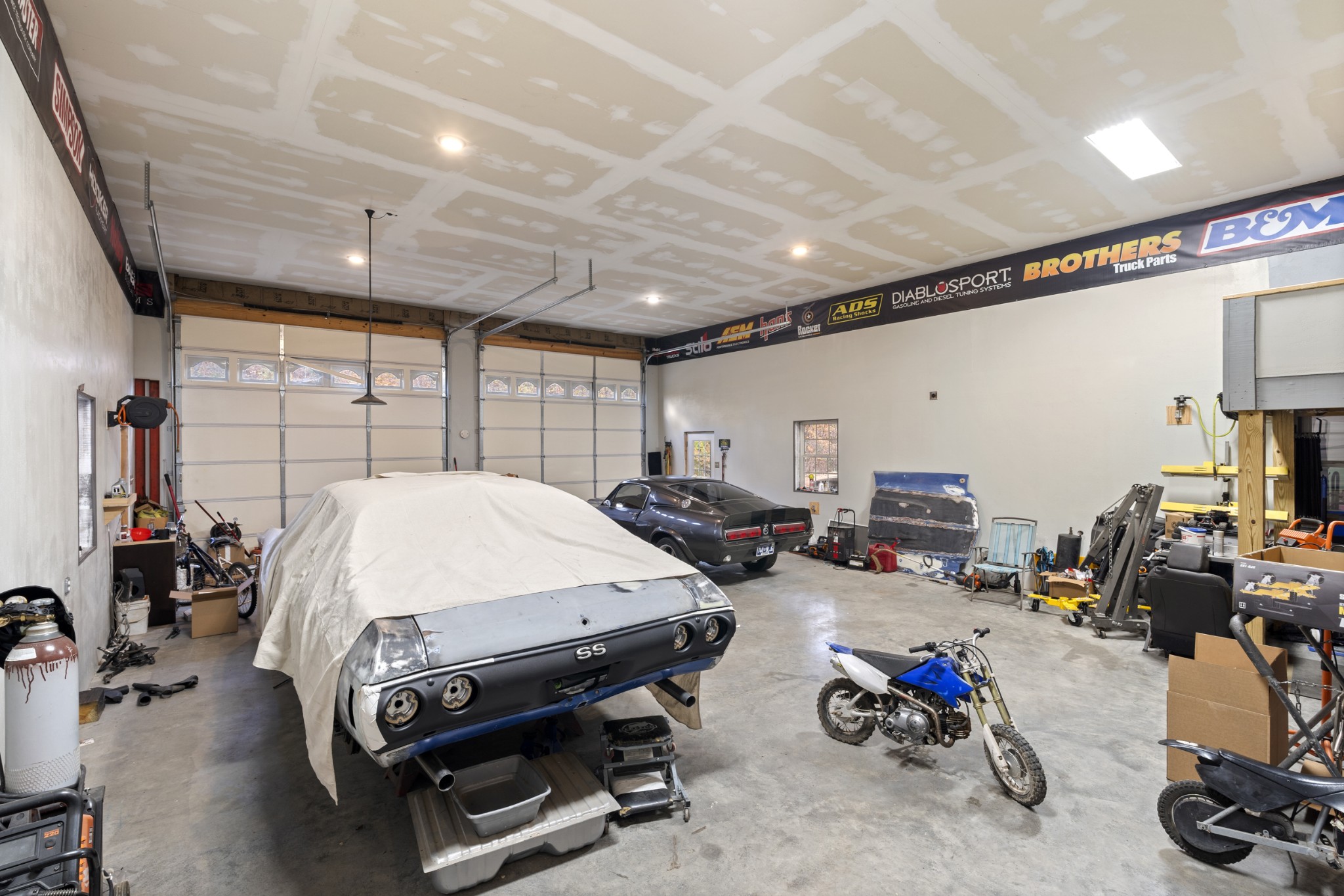 1148 Stoltz Road Centerville, TN 37033 - Photo 51 of 63 a bed room with furniture a flat screen tv and a window