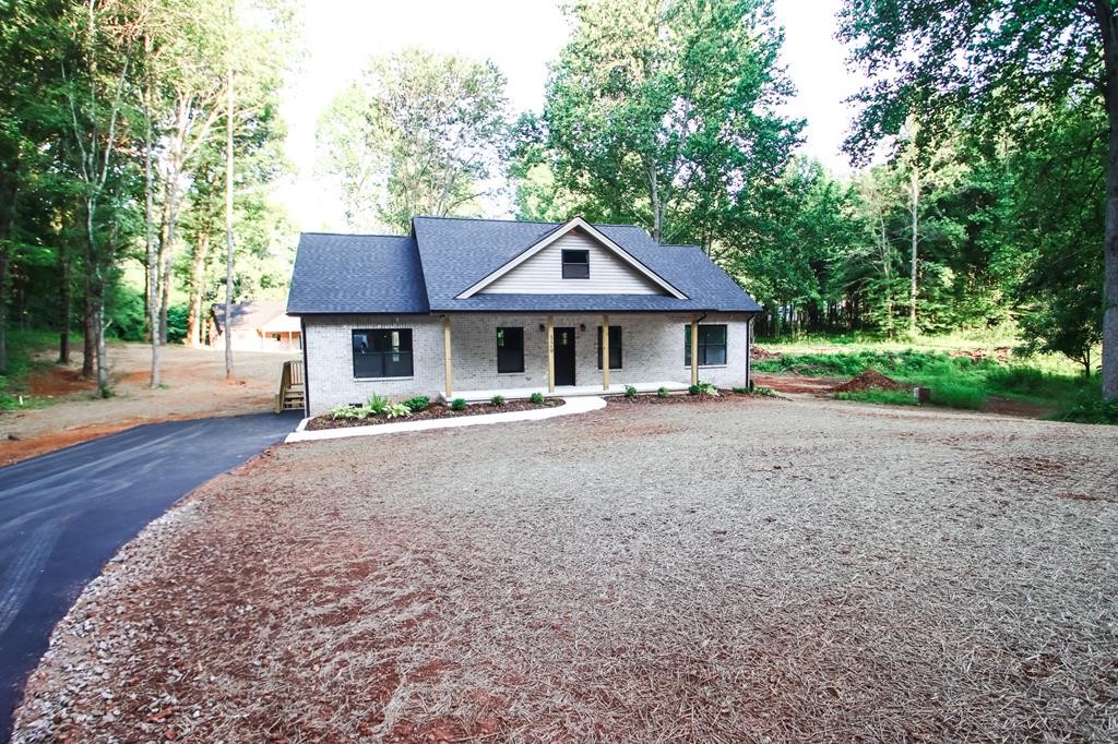 329 Webb Drive Sparta, TN 38583 - Photo 1 of 17 a front view of a house with a yard
