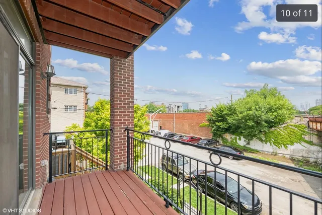 a view of a balcony with wooden floor