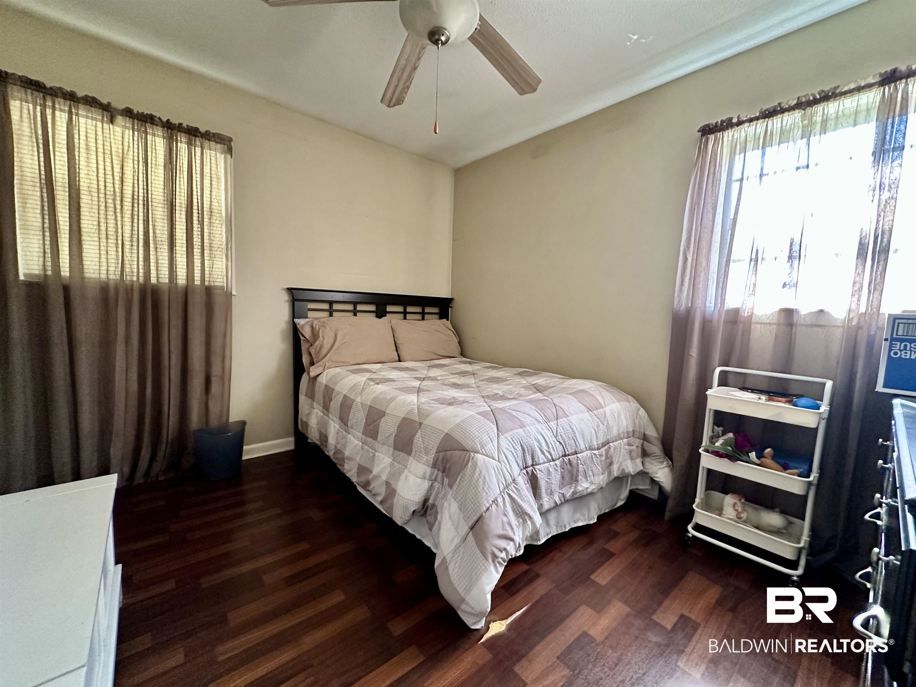 2593 Foshee Road Brewton, AL 36426 - Photo 9 of 15 Bedroom with dark hardwood / wood-style floors and ceiling fan