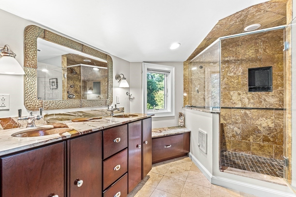 281 Cochituate Road Wayland, MA 01778 - Photo 22 of 38 a bathroom with a granite countertop sink a mirror and a shower