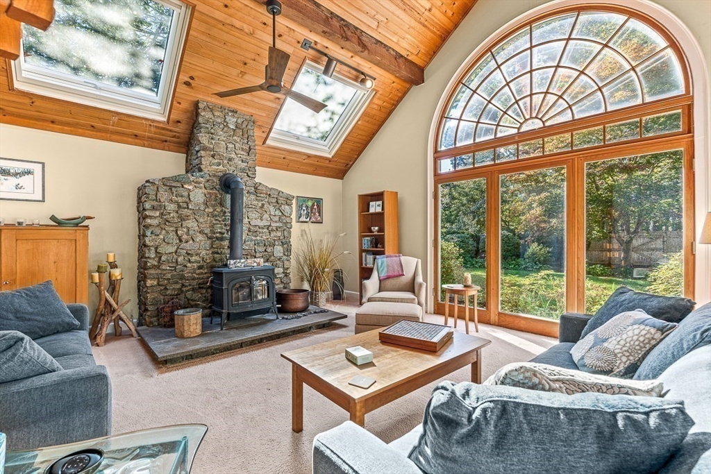 281 Cochituate Road Wayland, MA 01778 - Photo 7 of 38 a living room with furniture and a floor to ceiling window