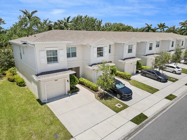 a aerial view of a house with a yard
