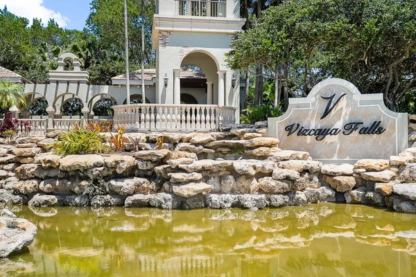 a view of swimming pool with outdoor seating and plants