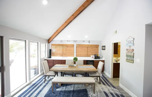 a view of a dining room with furniture window and outside view