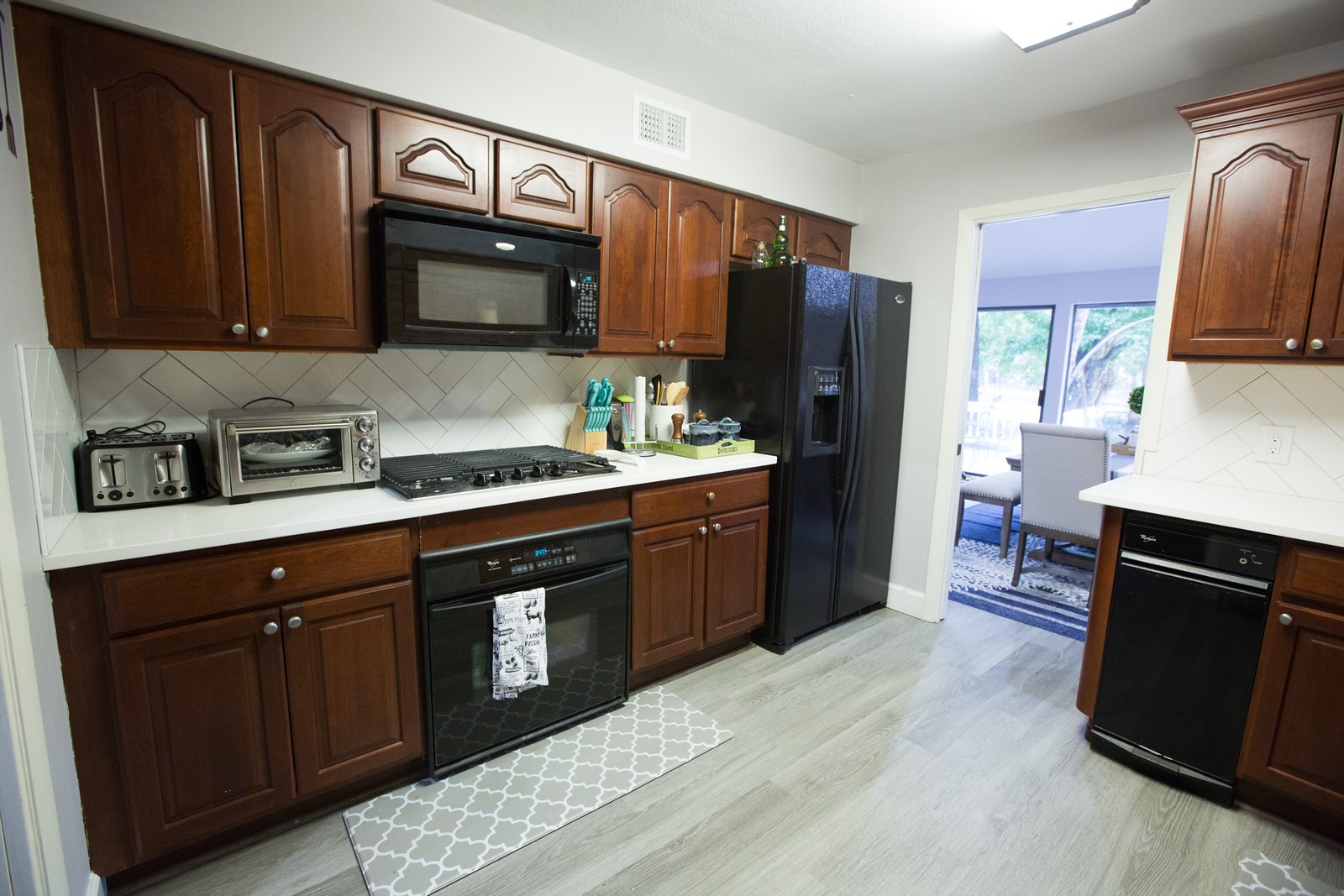 3007 Willowbend Road Montgomery, TX 77356 - Photo 20 of 43 a kitchen with stainless steel appliances granite countertop a refrigerator stove and sink