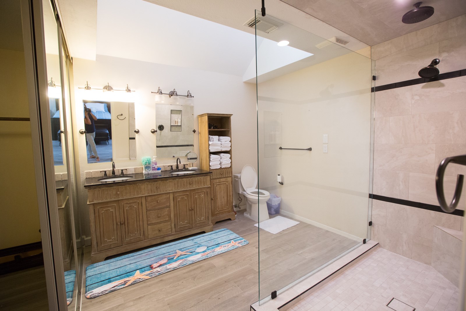 3007 Willowbend Road Montgomery, TX 77356 - Photo 25 of 43 a bathroom with a granite countertop sink mirror and a shower