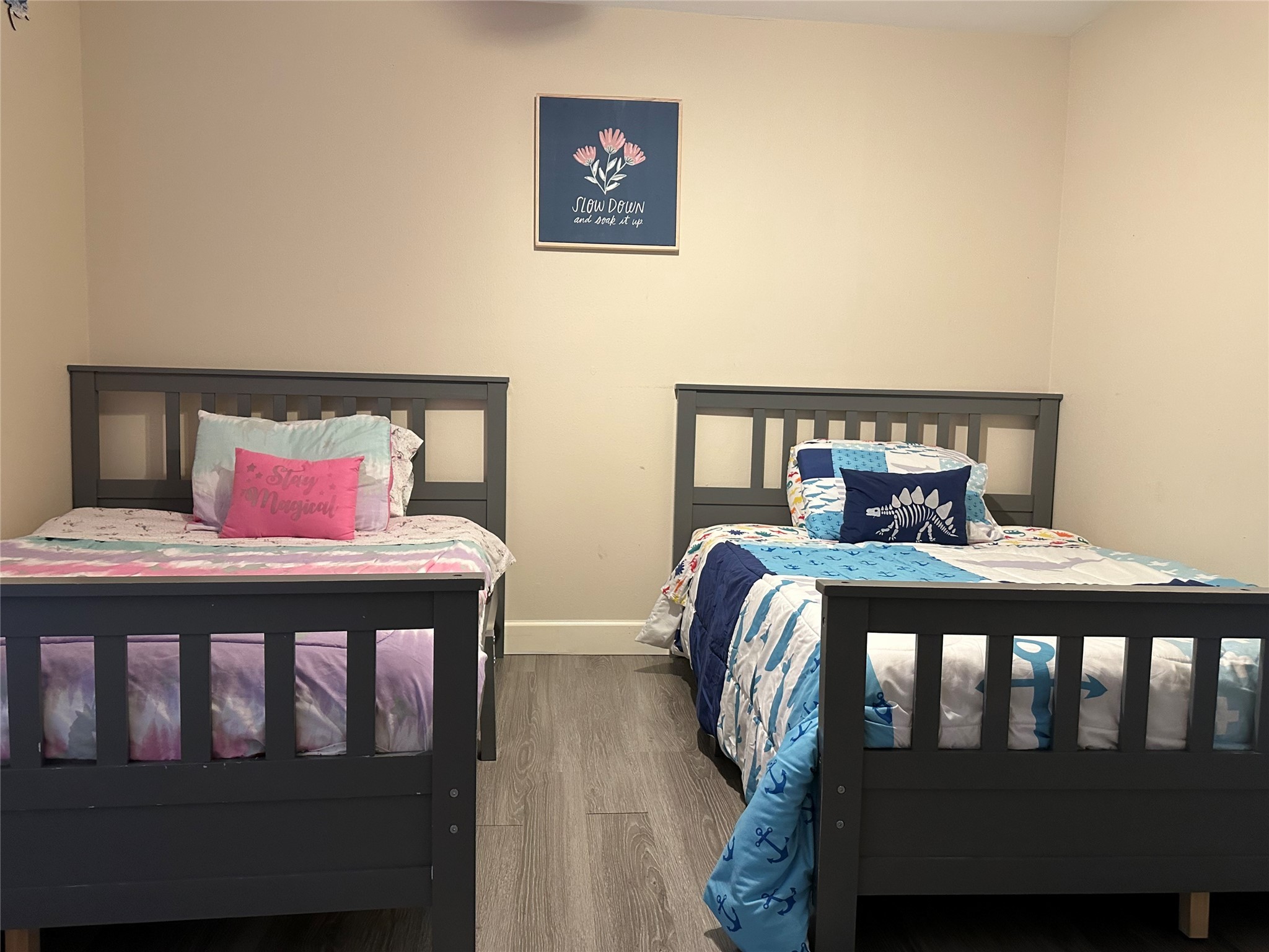 3007 Willowbend Road Montgomery, TX 77356 - Photo 26 of 43 a bedroom with a bed and wooden floor