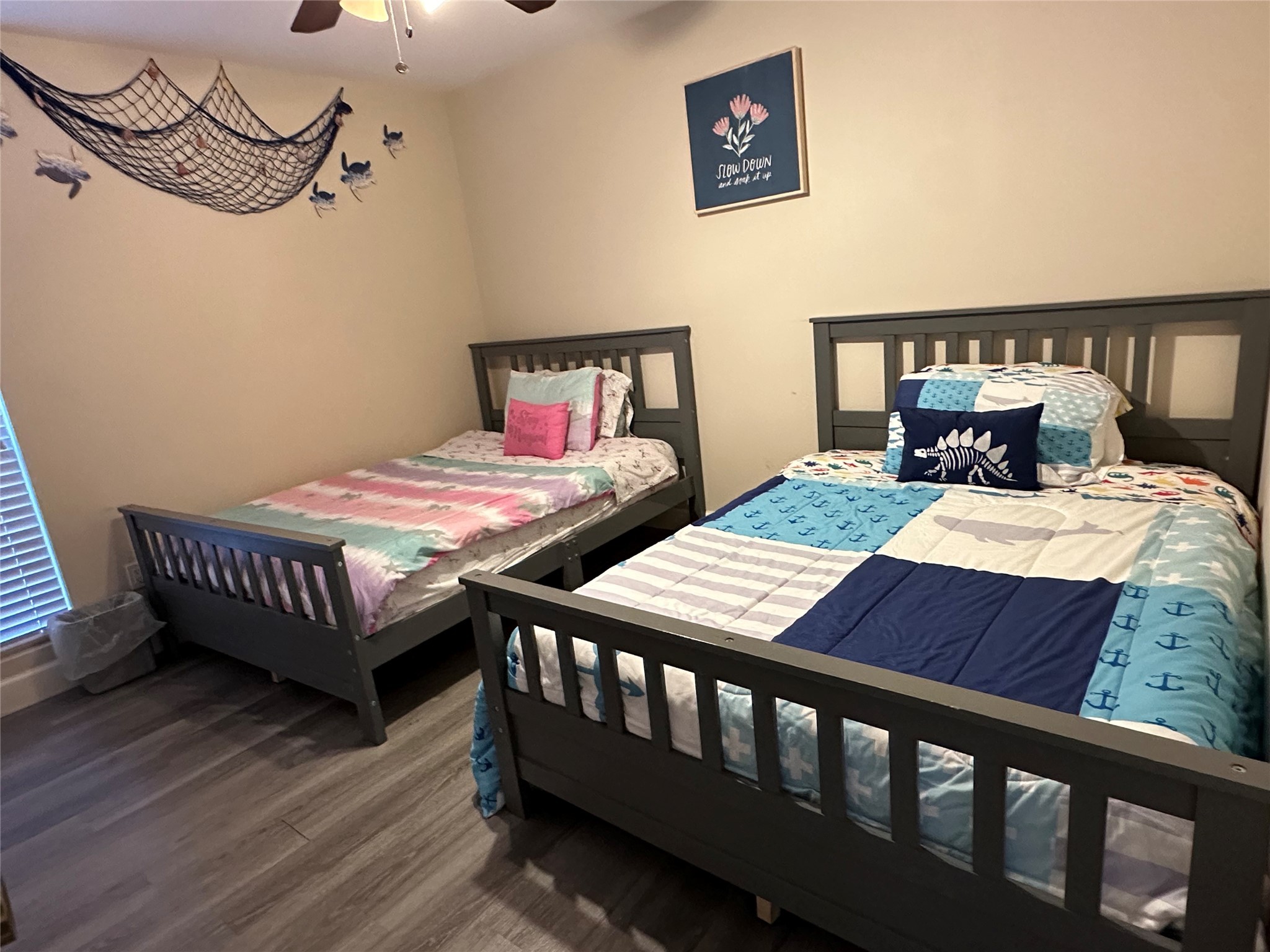 3007 Willowbend Road Montgomery, TX 77356 - Photo 27 of 43 a bedroom with two beds and wooden floor